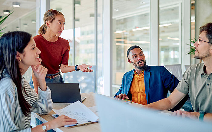 Business team collaborating during a meeting in a modern office.